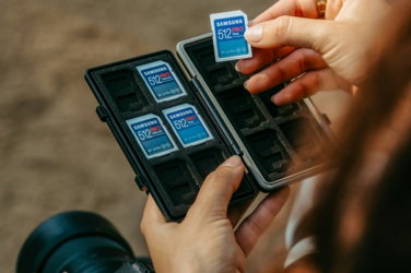hands-placing-sd-card-into-memory-card-holder.jpg Hands placing sd card into memory card holder